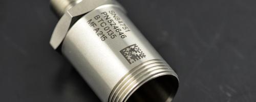 Metal component marked with a Datamatrix code and serial number 